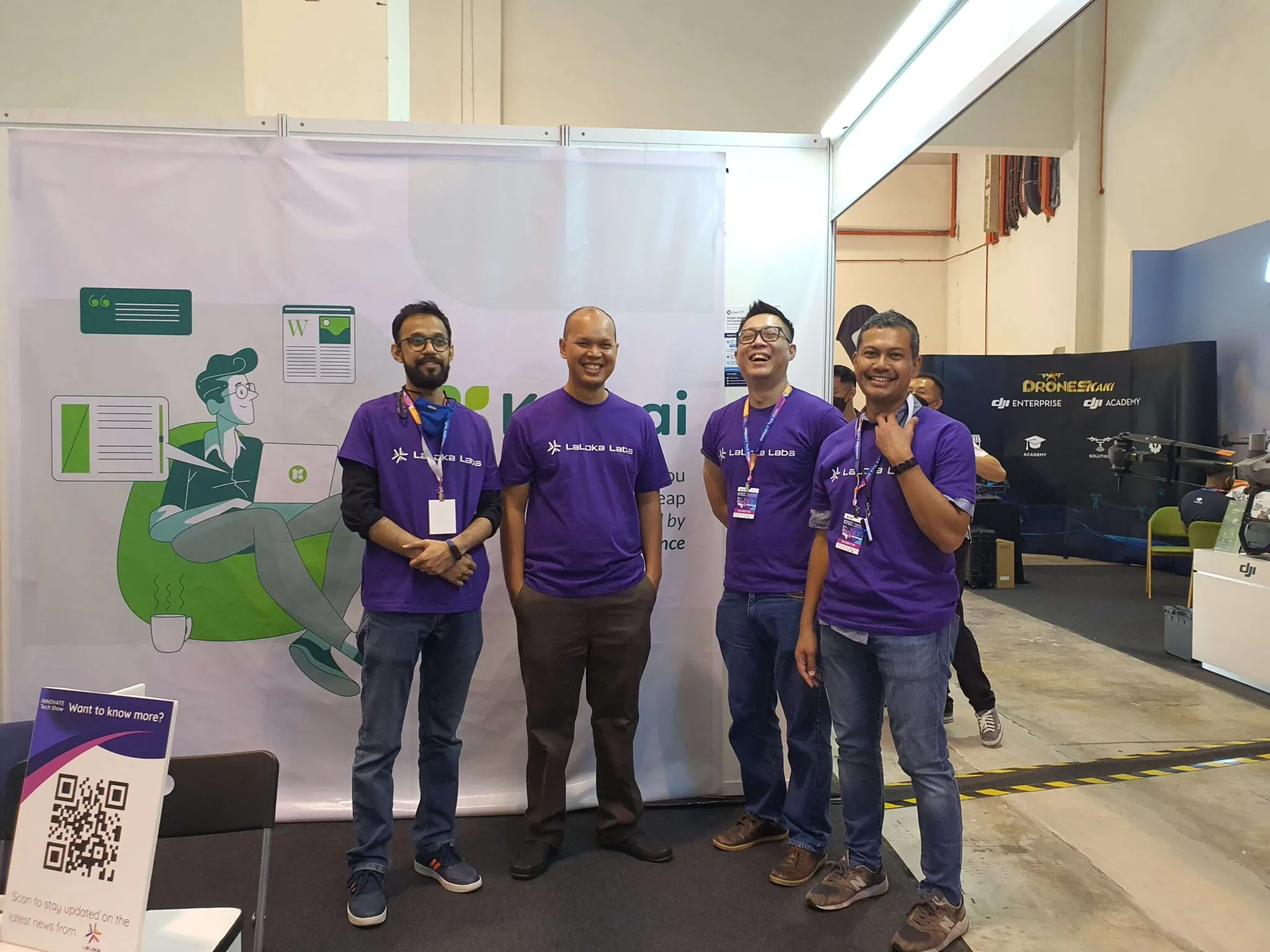 Photograph of four men from LaLoka Labs standing at their booth during the iNNOVATE Tech Show 2022 tradeshow event.