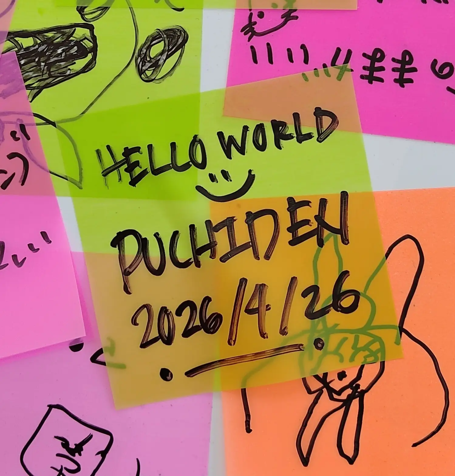 A handwritten note with the word "puchiden" scrawled in black marker on a vibrant pink background, creating a playful and casual aesthetic.